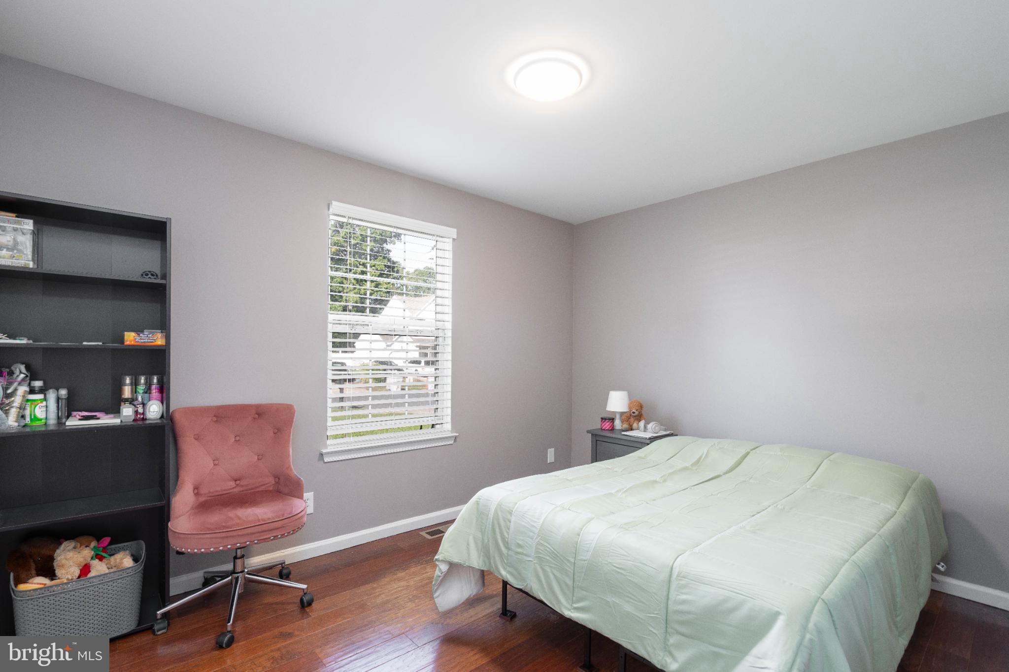 1249 Sassafras Drive Vineland, NJ 08360 - Photo 14 of 34 a bedroom with a bed chair and a window