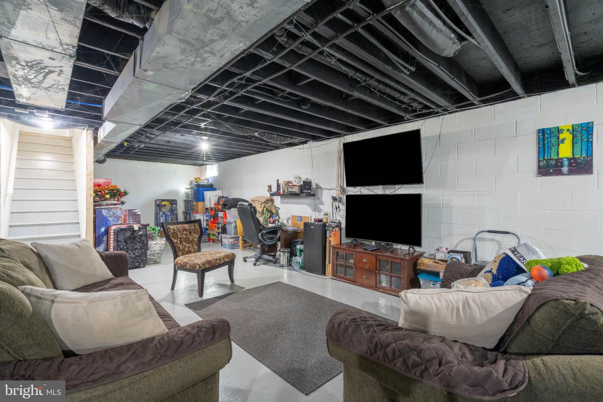 1249 Sassafras Drive Vineland, NJ 08360 - Photo 24 of 34 a living room with furniture and a flat screen tv