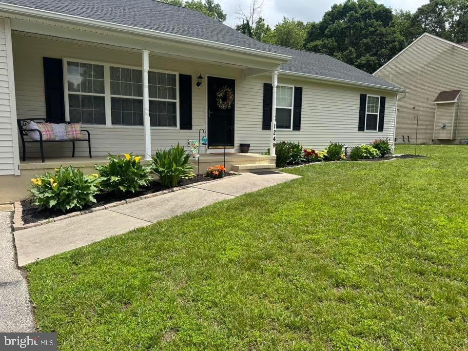 1249 Sassafras Drive Vineland, NJ 08360 - Photo 28 of 34 a front view of a house with garden and porch