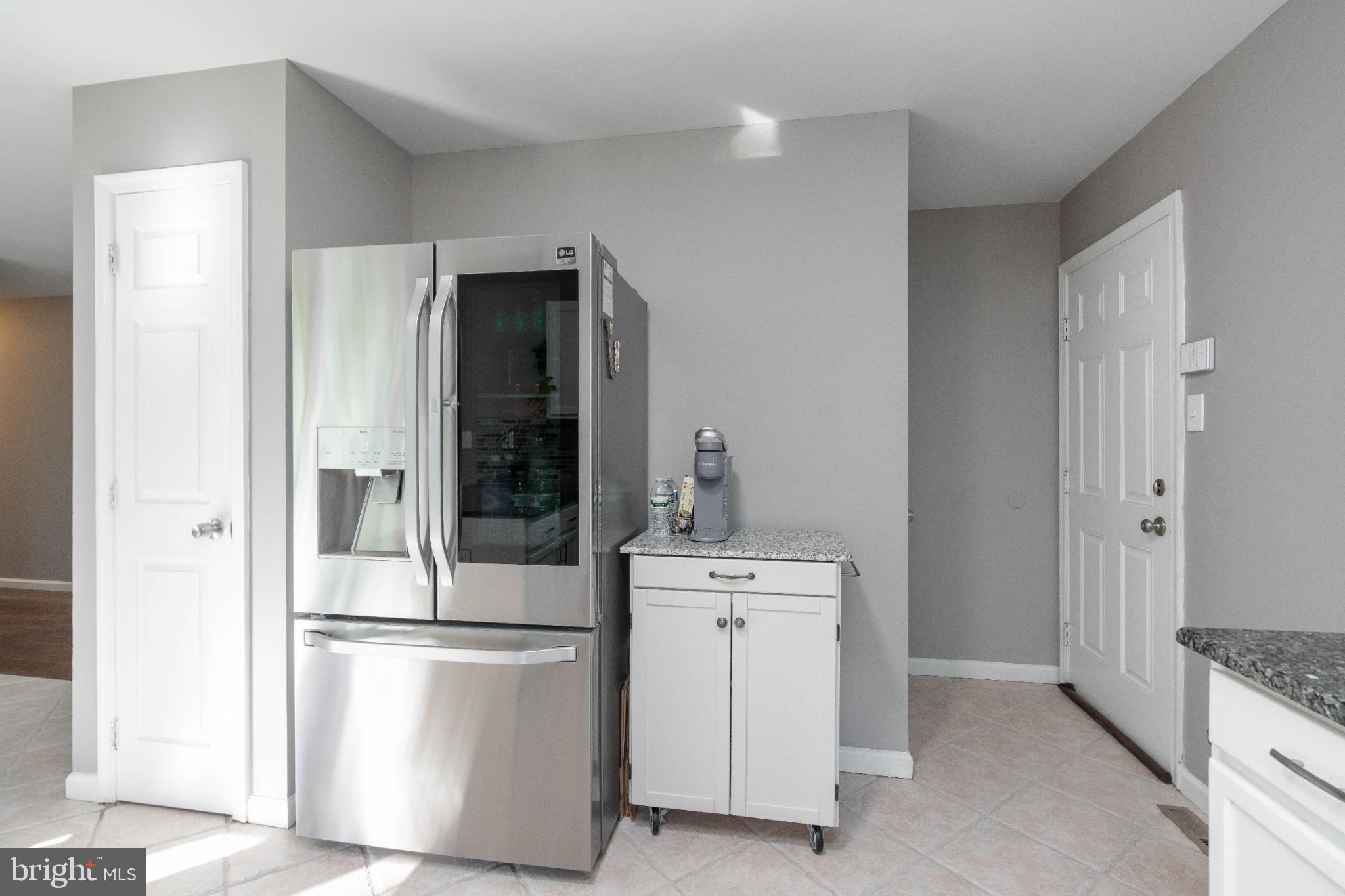 1249 Sassafras Drive Vineland, NJ 08360 - Photo 10 of 34 a kitchen with a refrigerator sink stove and cabinets