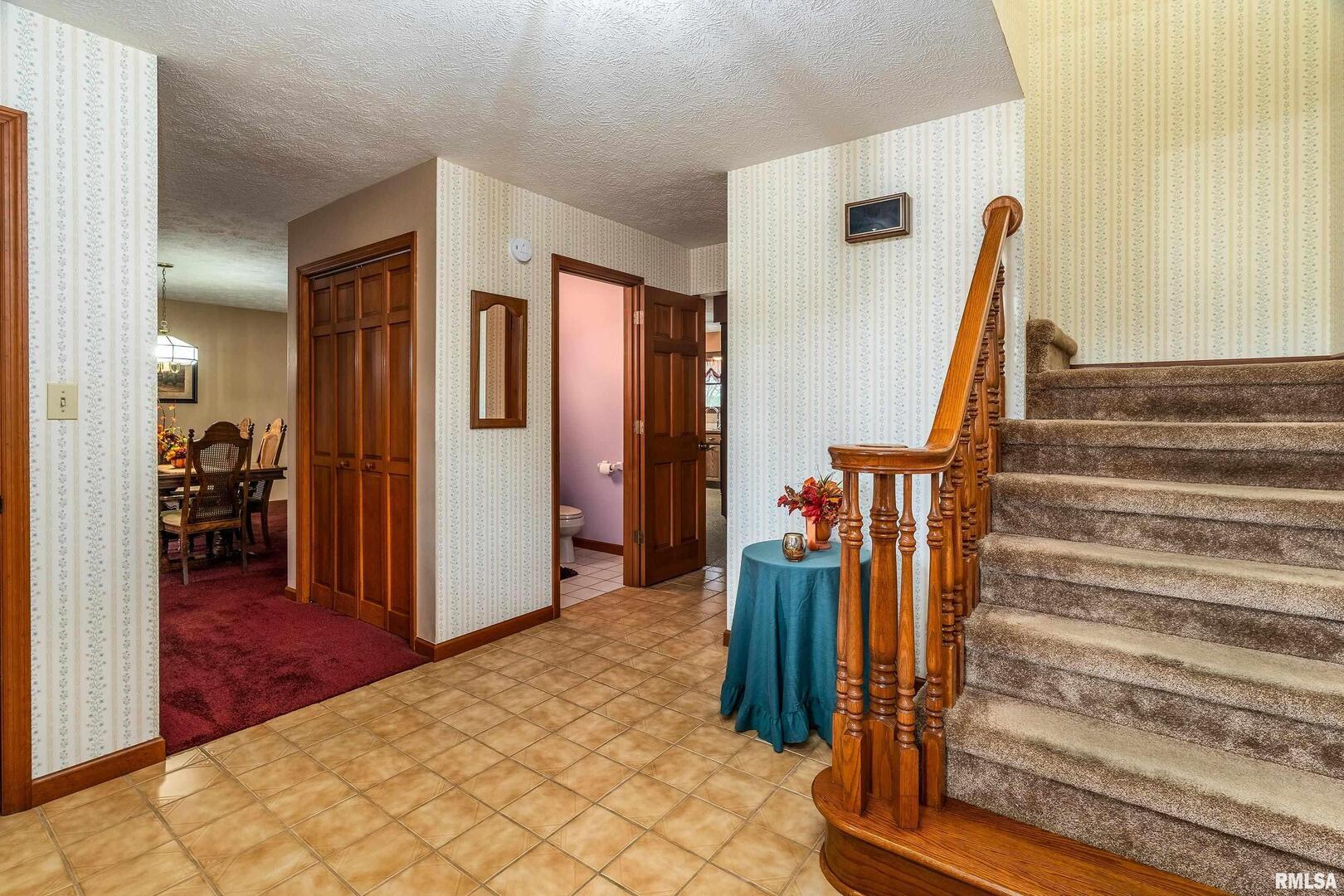 11688 Strawberry Road Carbondale, IL 62901 - Photo 14 of 36 a view of a livingroom with wooden floor and stairs
