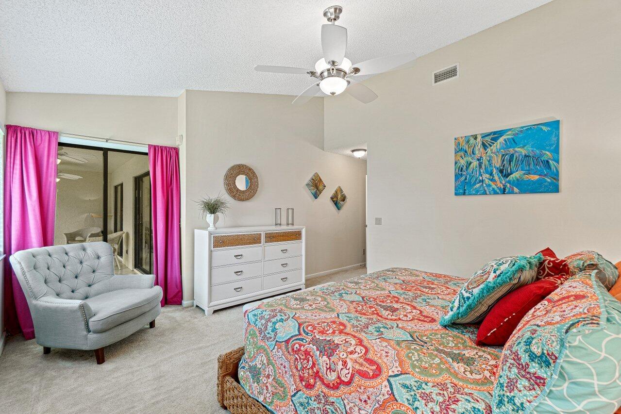5690 Coach House Circle, Unit G Boca Raton, FL 33486 - Photo 16 of 33 PRIMARY SUITE WITH SLIDERS TO BALCONY