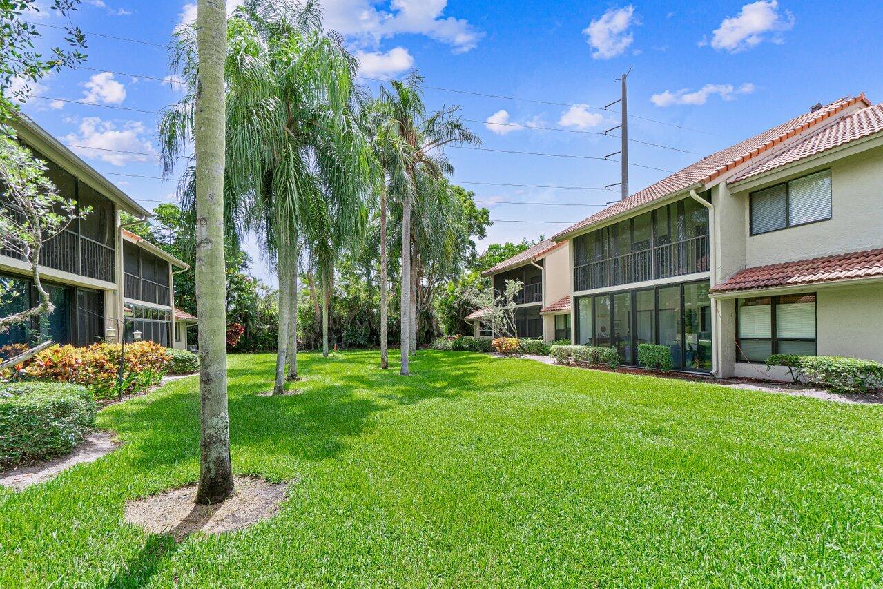 5690 Coach House Circle, Unit G Boca Raton, FL 33486 - Photo 25 of 33 TROPICAL COURTYARD