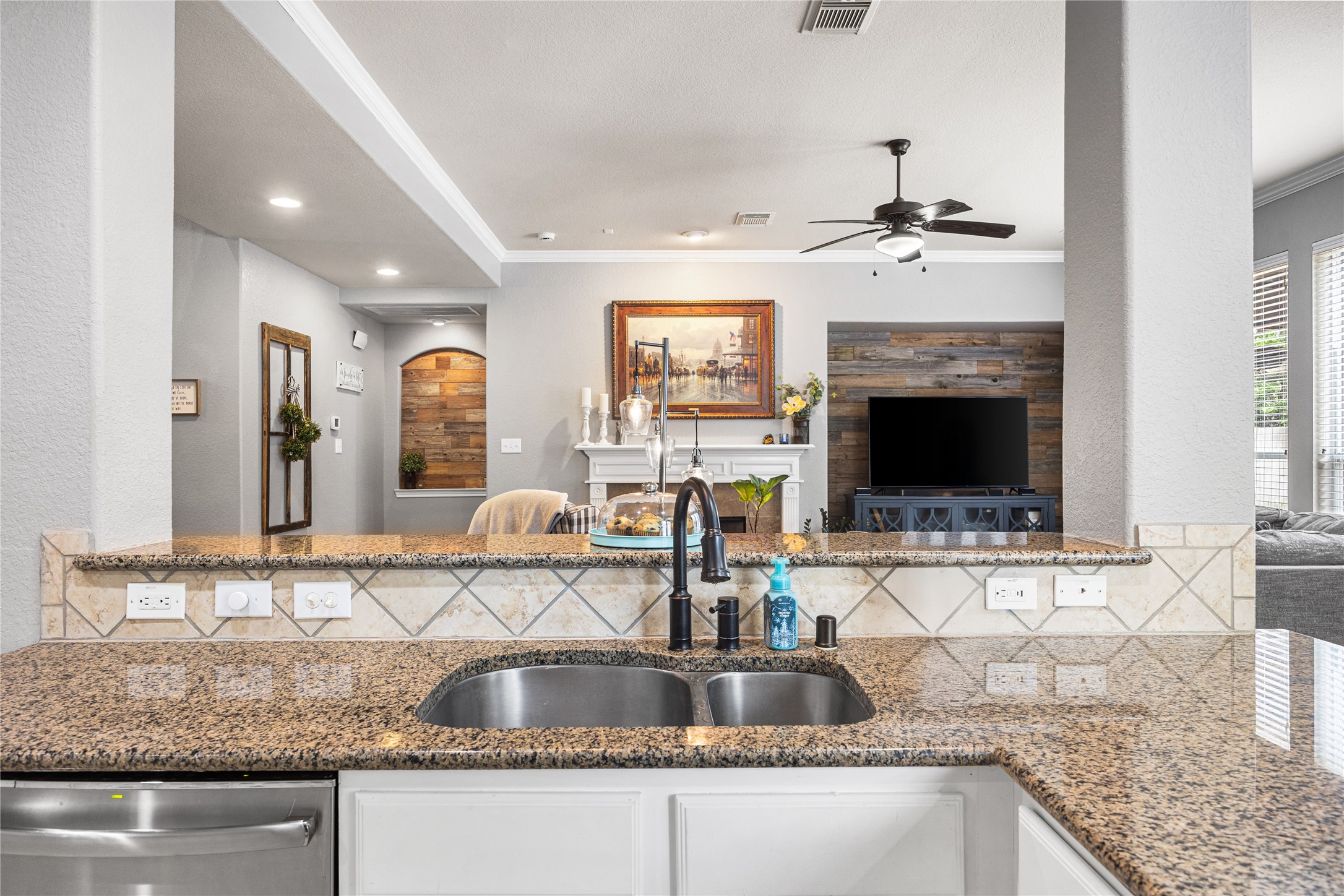2167 Summit Mist Drive Conroe, TX 77304 - Photo 11 of 34 a kitchen with granite countertop a sink a counter top space and cabinets