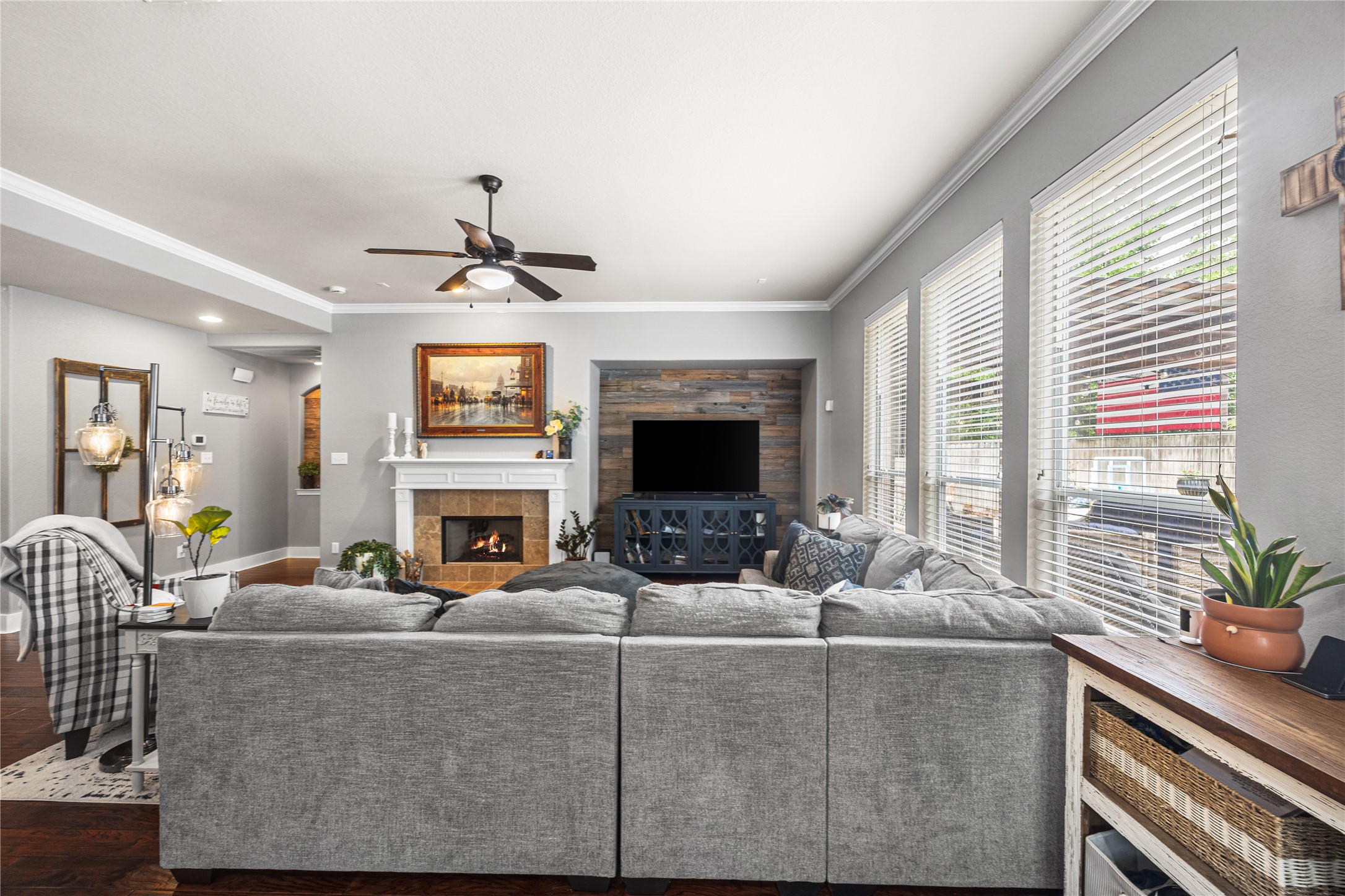 2167 Summit Mist Drive Conroe, TX 77304 - Photo 15 of 34 a living room with furniture a fireplace and a large window