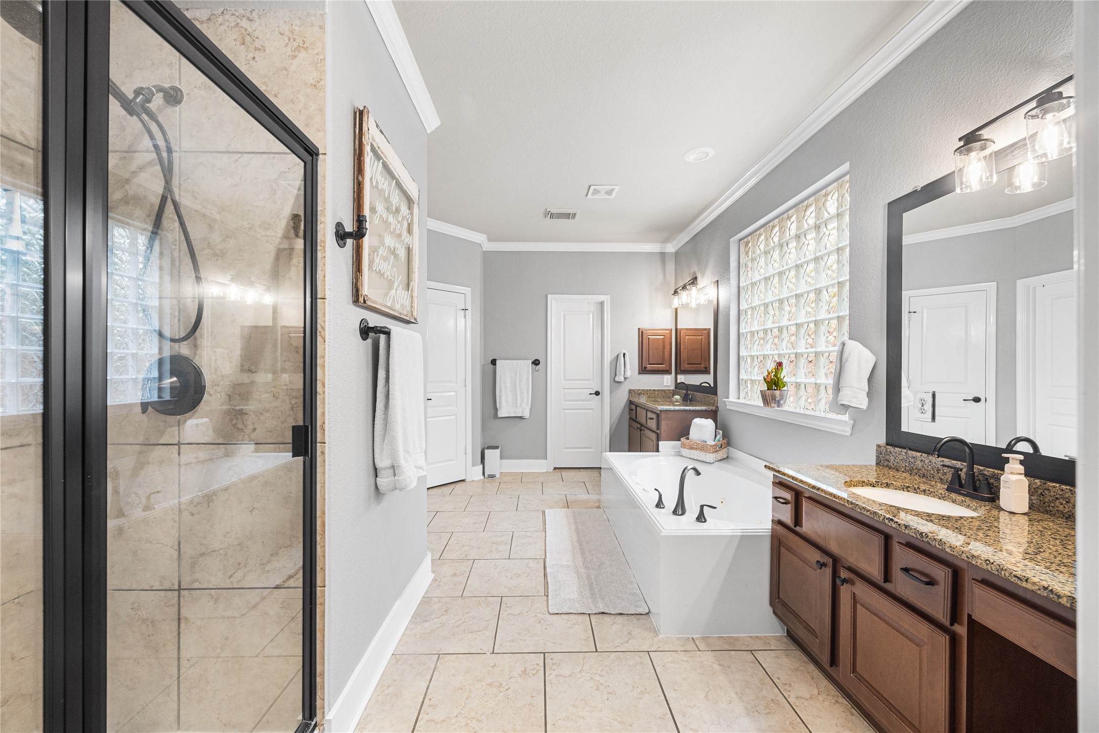 2167 Summit Mist Drive Conroe, TX 77304 - Photo 20 of 34 a large white kitchen with a large window and stainless steel appliances