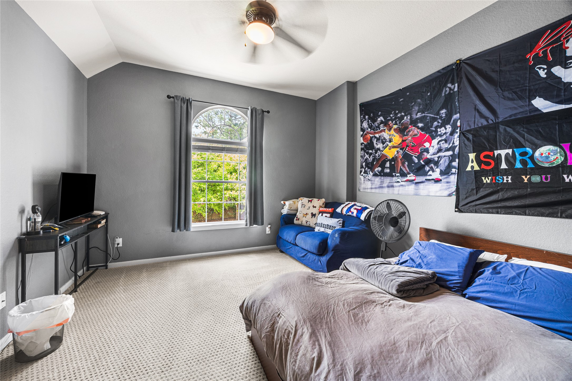 2167 Summit Mist Drive Conroe, TX 77304 - Photo 24 of 34 a bedroom with furniture and a flat screen tv