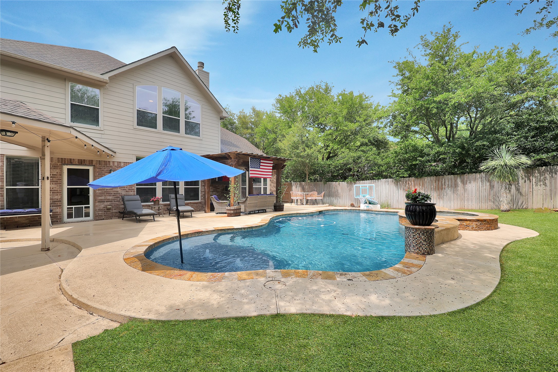 2167 Summit Mist Drive Conroe, TX 77304 - Photo 32 of 34 a view of outdoor space yard and swimming pool