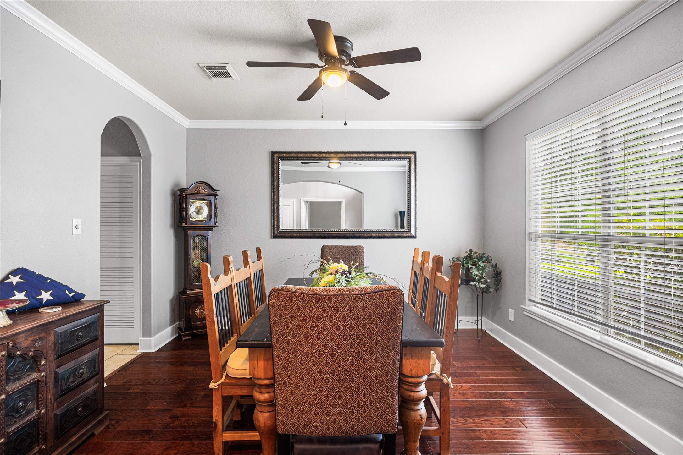 2167 Summit Mist Drive Conroe, TX 77304 - Photo 7 of 34 a dining room with furniture a chandelier and wooden floor