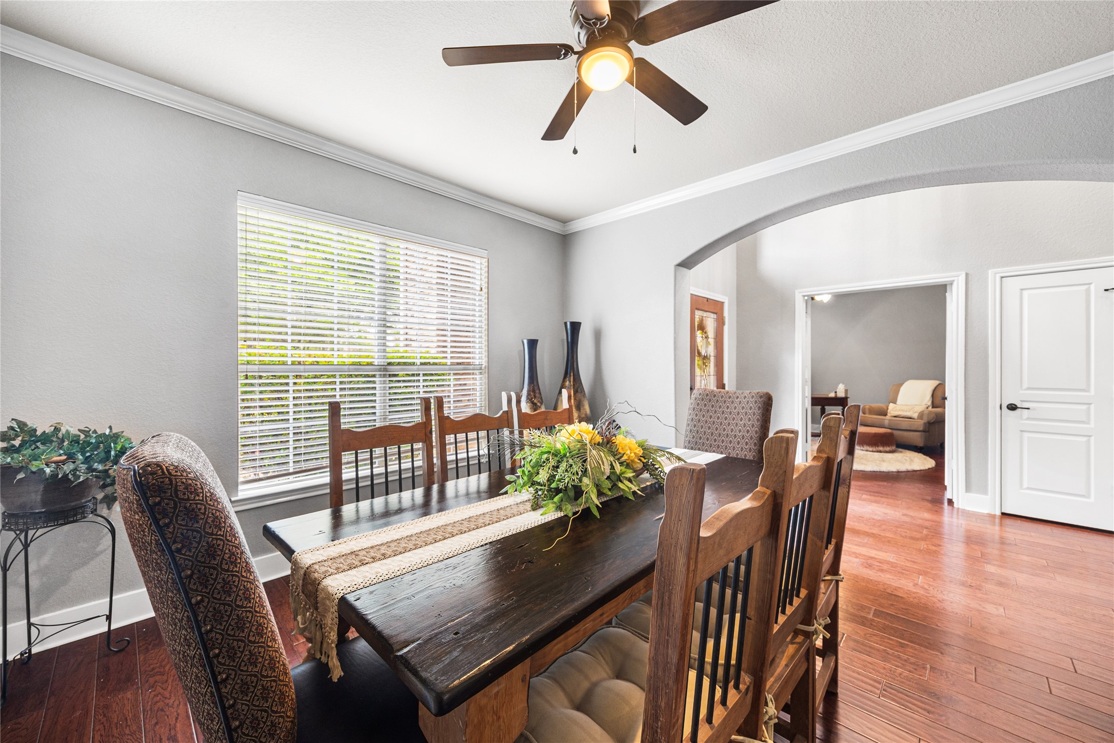 2167 Summit Mist Drive Conroe, TX 77304 - Photo 8 of 34 a view of a dining room with furniture window and wooden floor