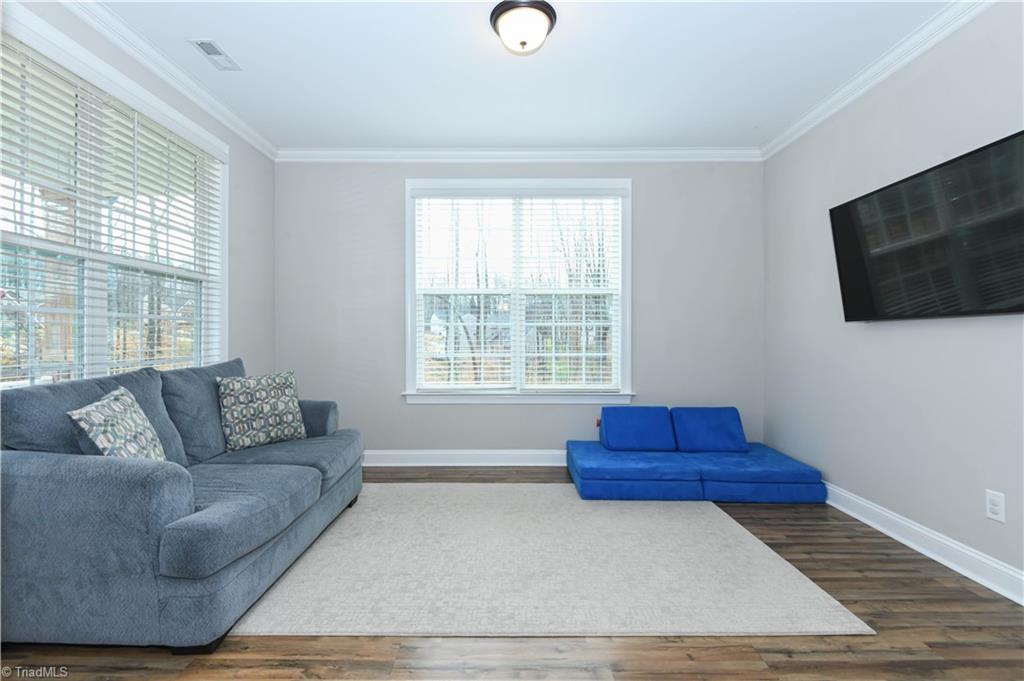 7729 Carson Path Summerfield, NC 27358 - Photo 13 of 48 Living room/playroom