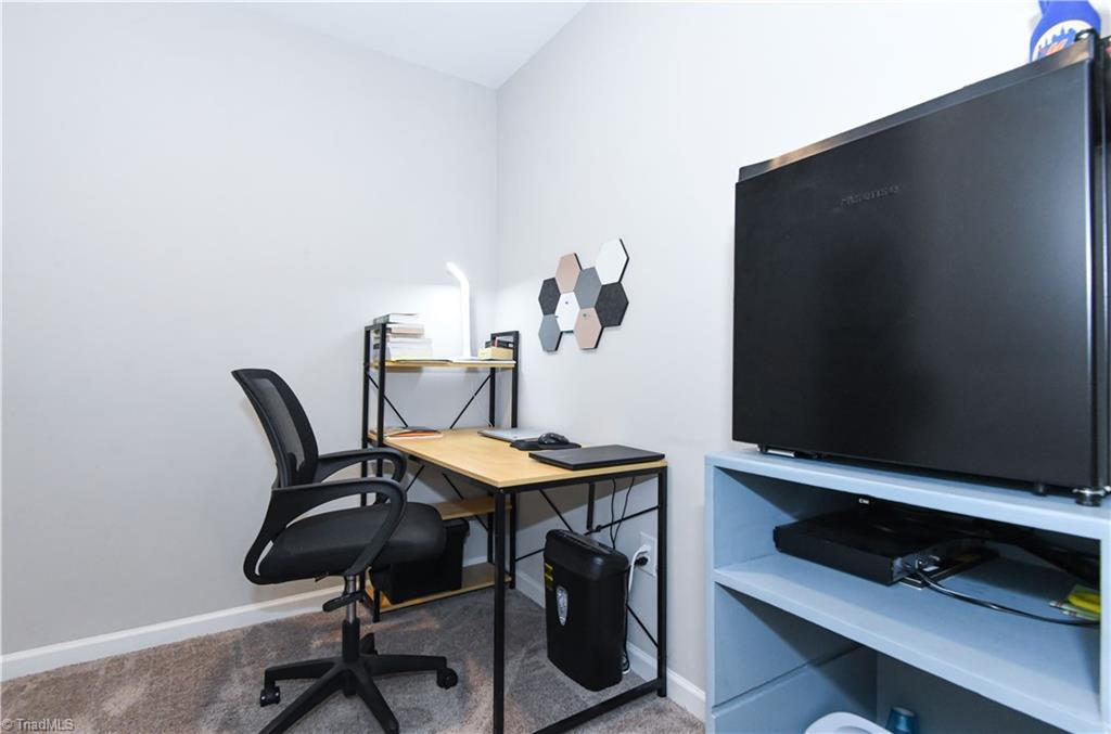 7729 Carson Path Summerfield, NC 27358 - Photo 34 of 48 One of the primary closets made into private office