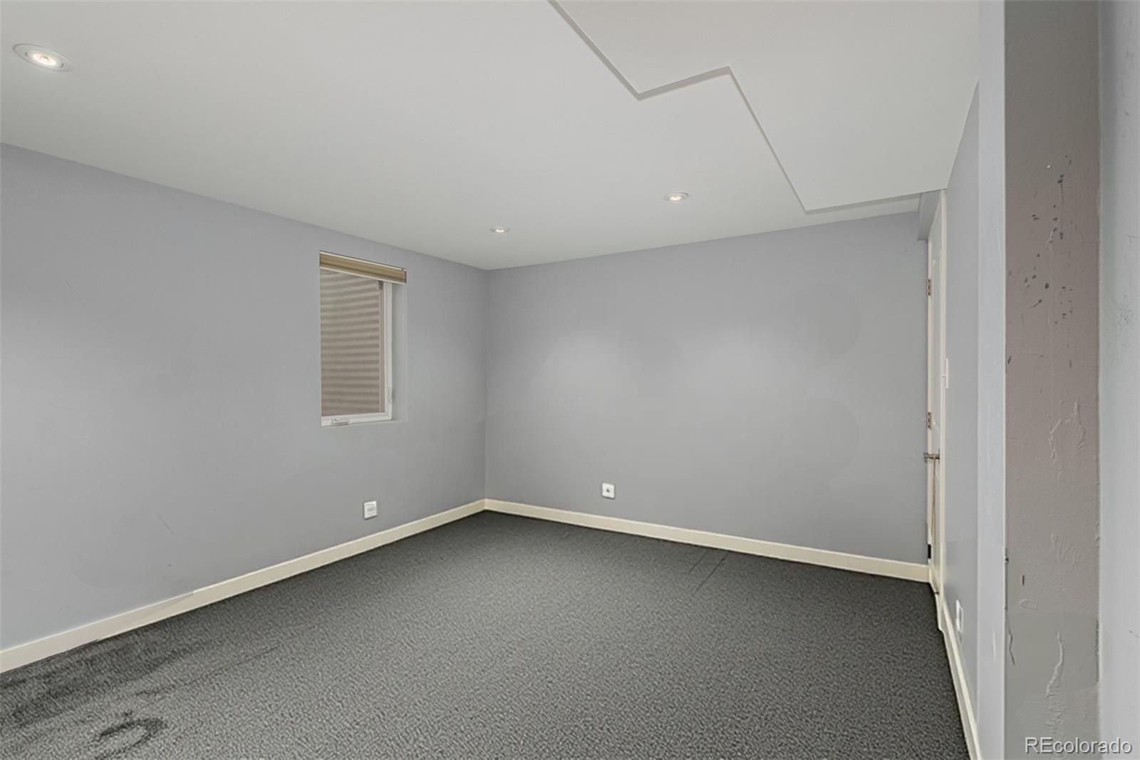 3650 Oneida Street Denver, CO 80207 - Photo 17 of 31 an empty room with a window