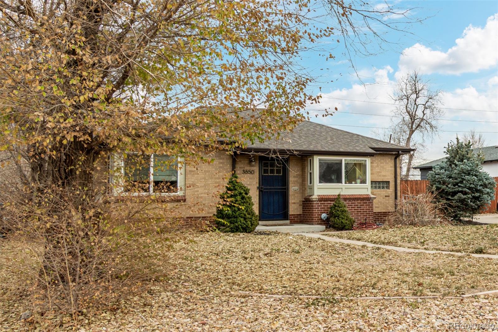 3650 Oneida Street Denver, CO 80207 - Photo 6 of 28 front view of a house with a yard