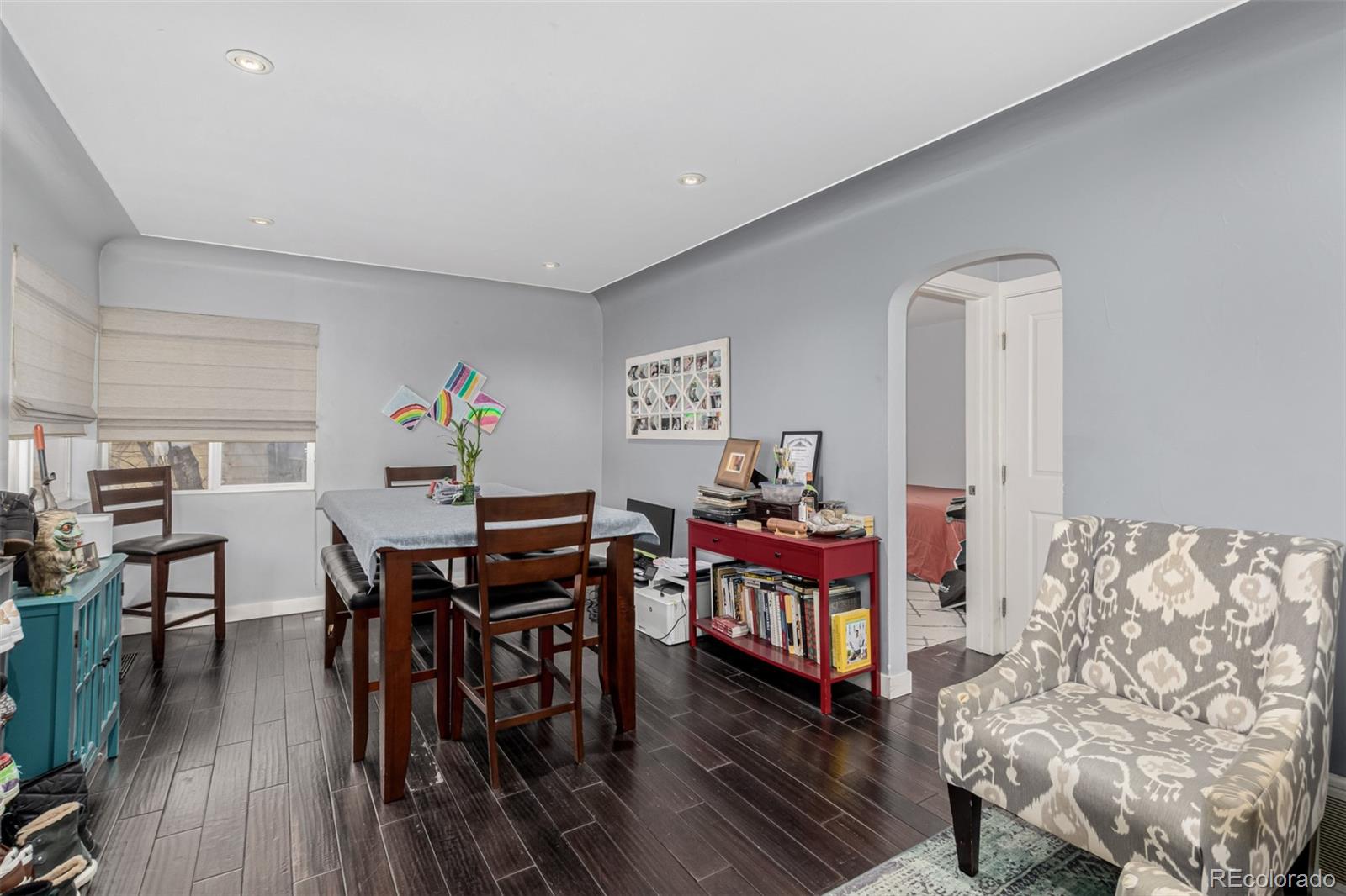 3650 Oneida Street Denver, CO 80207 - Photo 8 of 28 a view of a livingroom with furniture and wooden floor