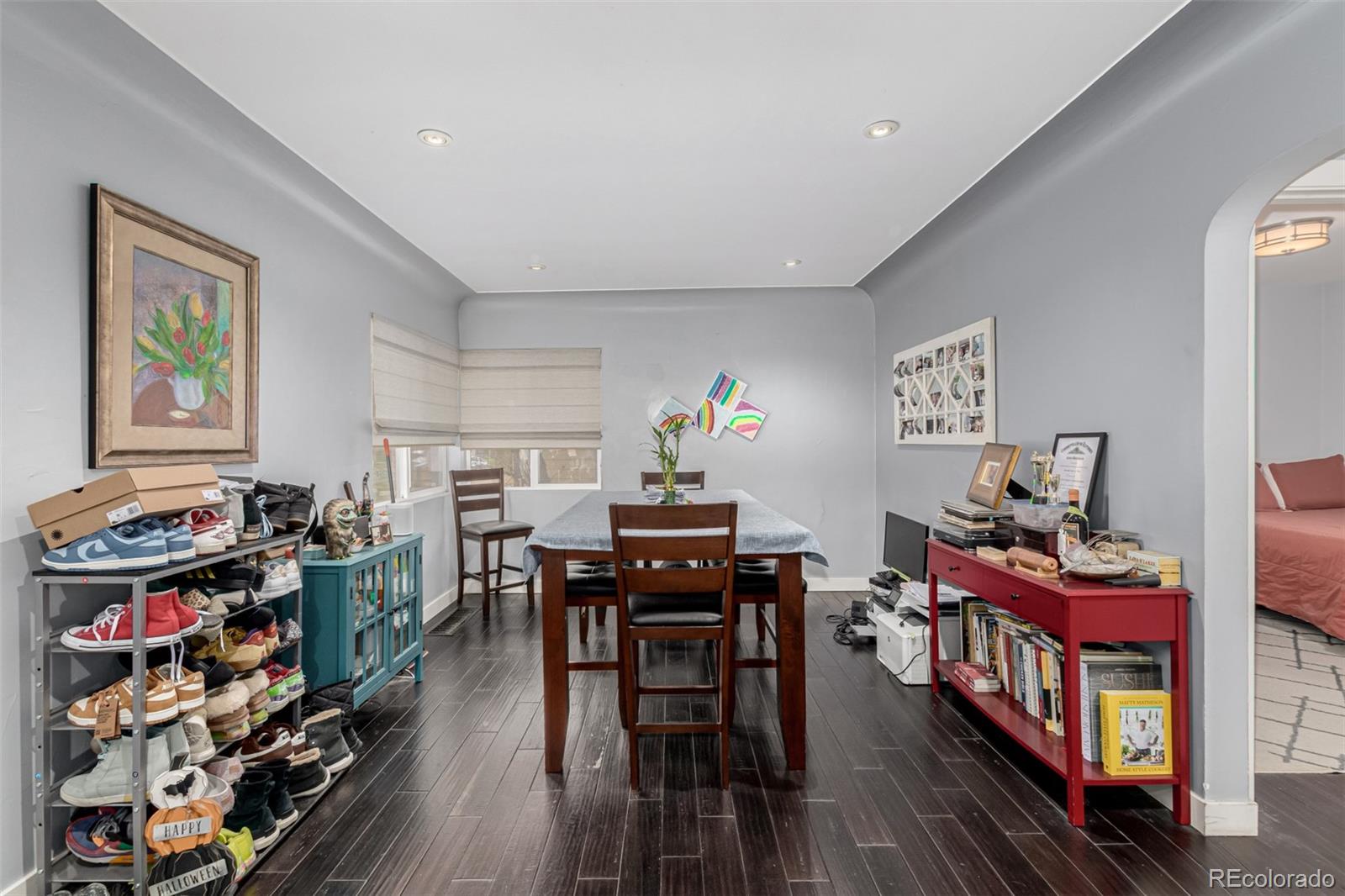 3650 Oneida Street Denver, CO 80207 - Photo 9 of 28 a living room with lots of furniture and wooden floor