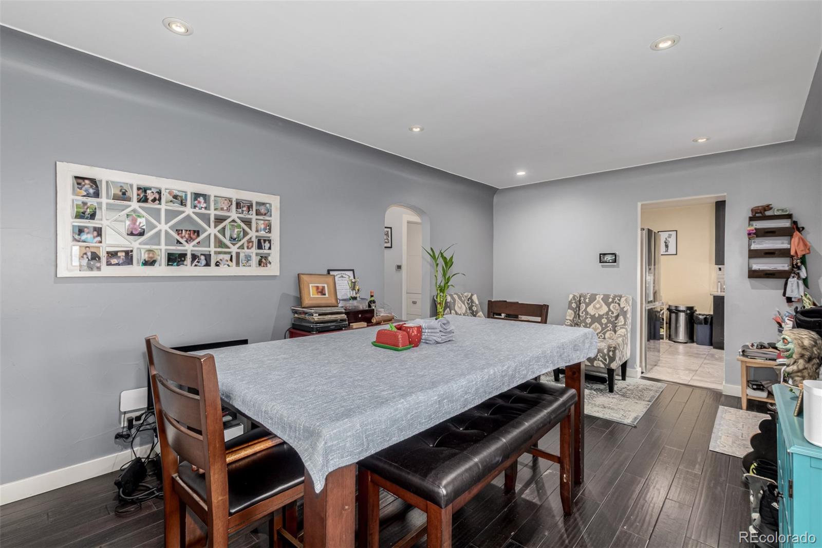 3650 Oneida Street Denver, CO 80207 - Photo 10 of 28 a view of a dining room with furniture and wooden floor