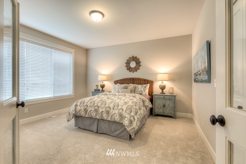 1438 241st Place Southeast Bothell, WA 98021 - Photo 8 of 19 a bedroom with a bed and a window
