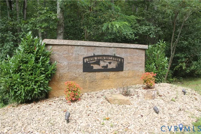 a view of a rural road with plants