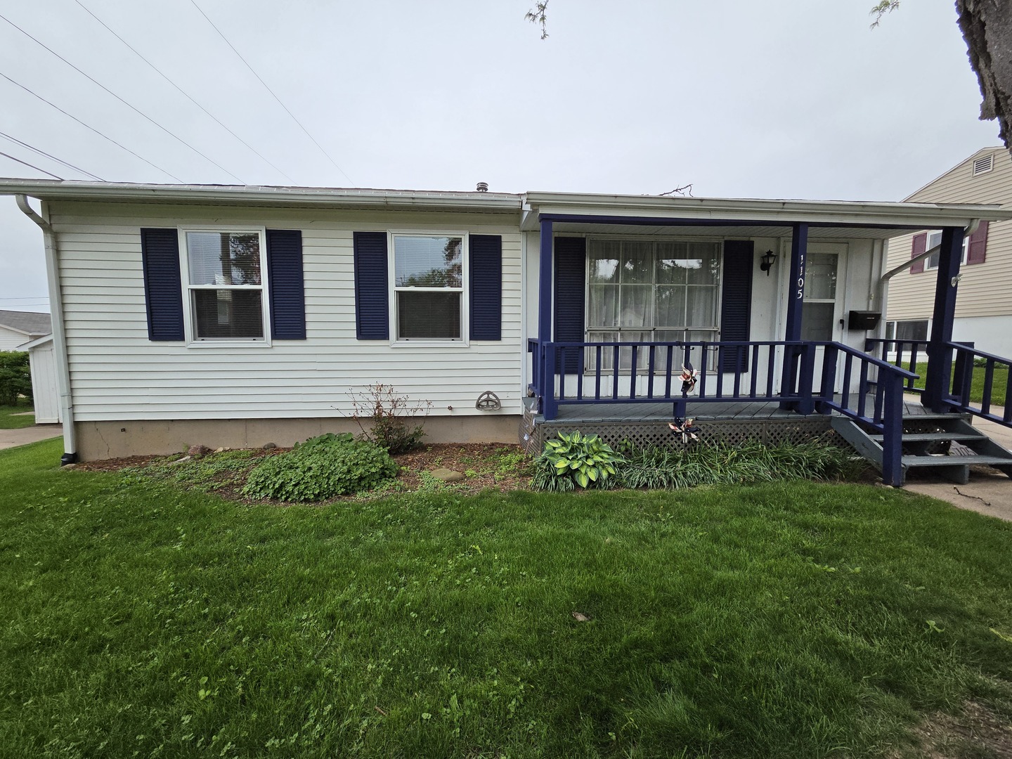1105 6th Street West Milan, IL 61264 - Photo 1 of 23 a view of a house with backyard and sitting area