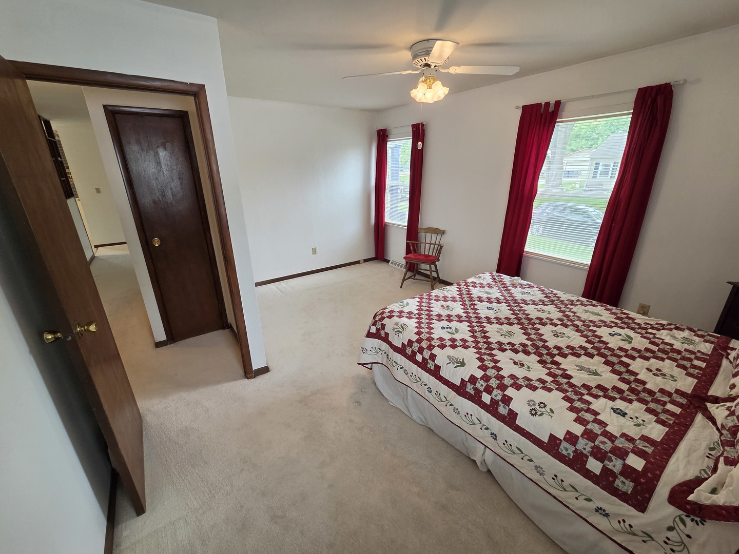 1105 6th Street West Milan, IL 61264 - Photo 12 of 23 a bedroom with a bed and a flat tv screen on dresser