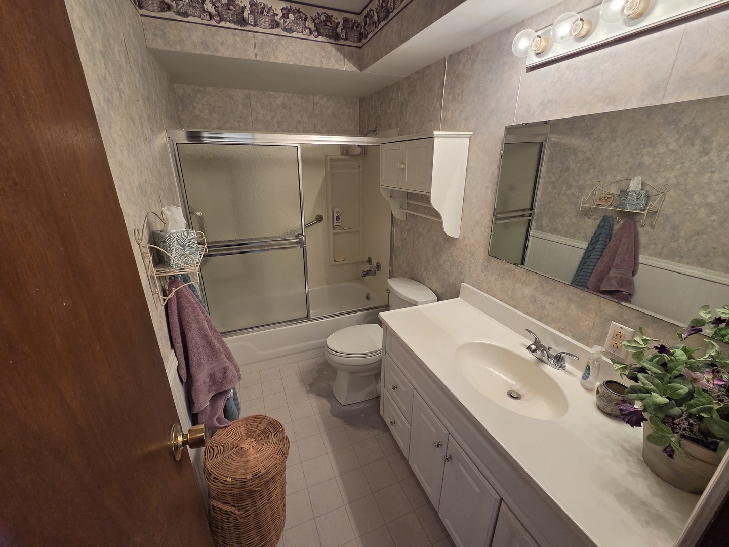1105 6th Street West Milan, IL 61264 - Photo 16 of 23 a bathroom with a sink toilet and shower