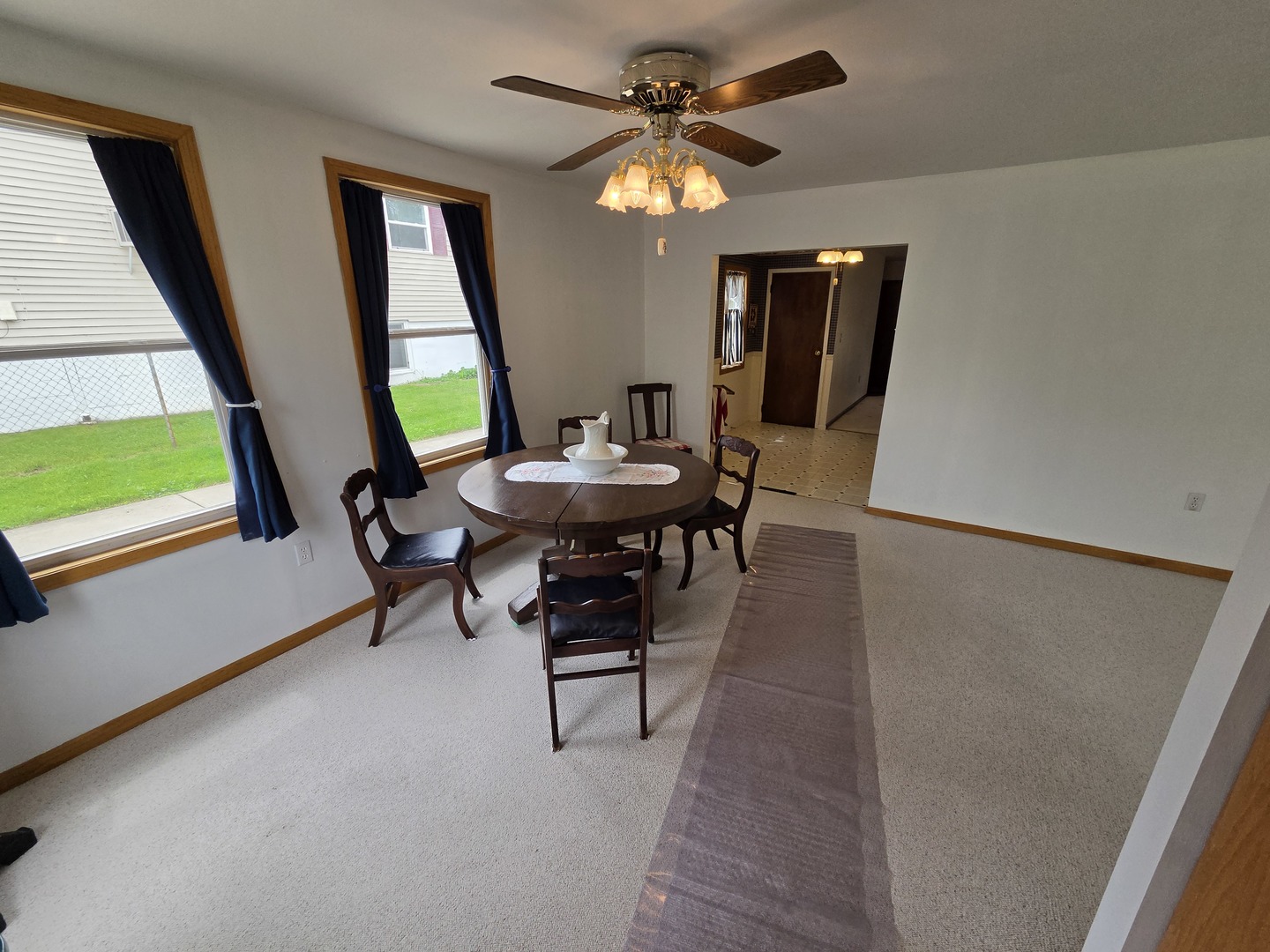1105 6th Street West Milan, IL 61264 - Photo 4 of 23 a workspace with furniture window and a ceiling fan