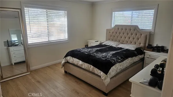 a living room with a bed furniture and a window