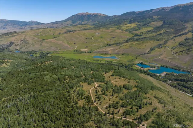 a view of a mountain with a mountain in the background