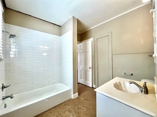 a bathroom with a sink and a bathtub