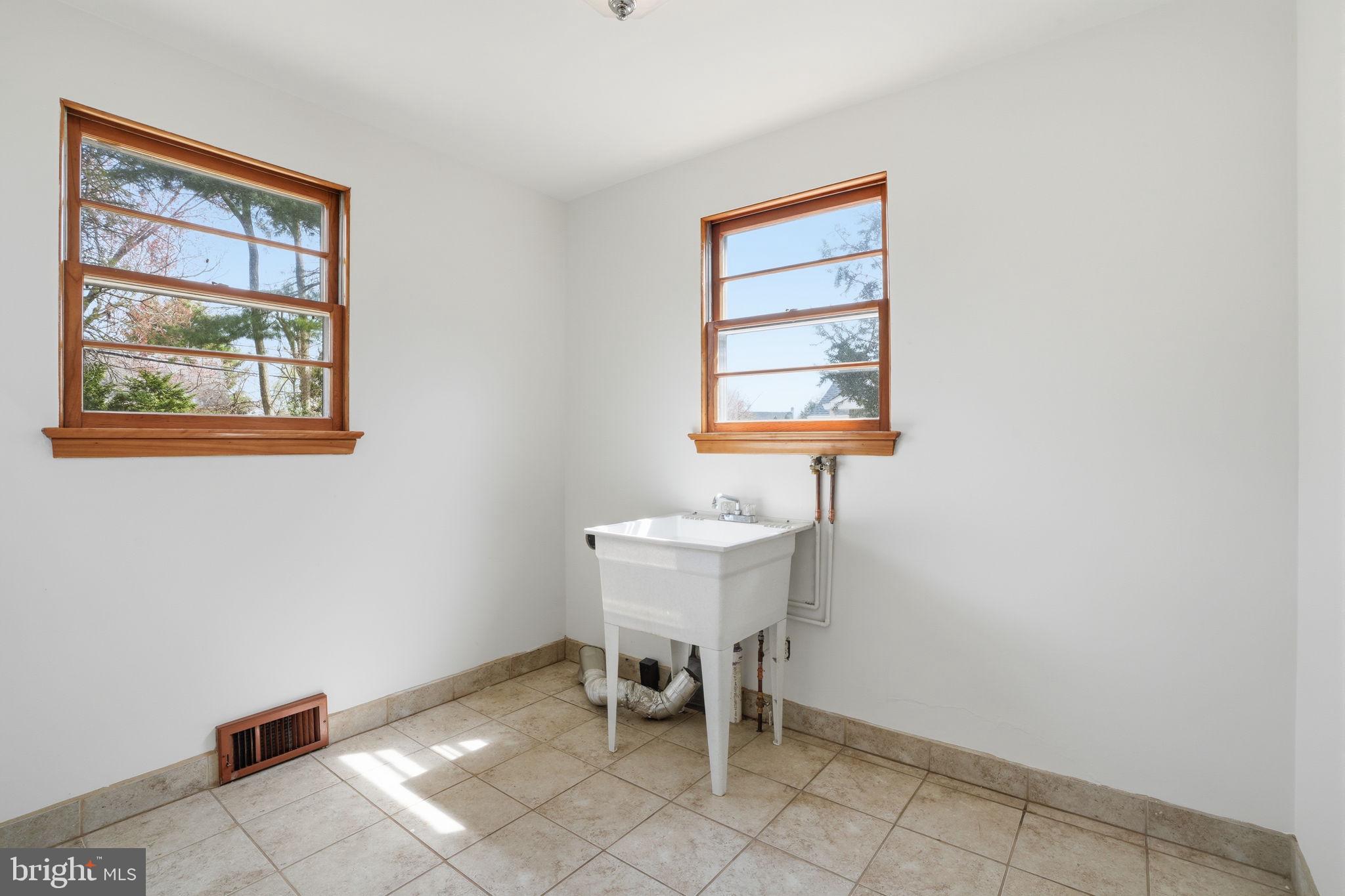 10 Home Road Hatboro, PA 19040 - Photo 17 of 42 a dining room with a window and chairs