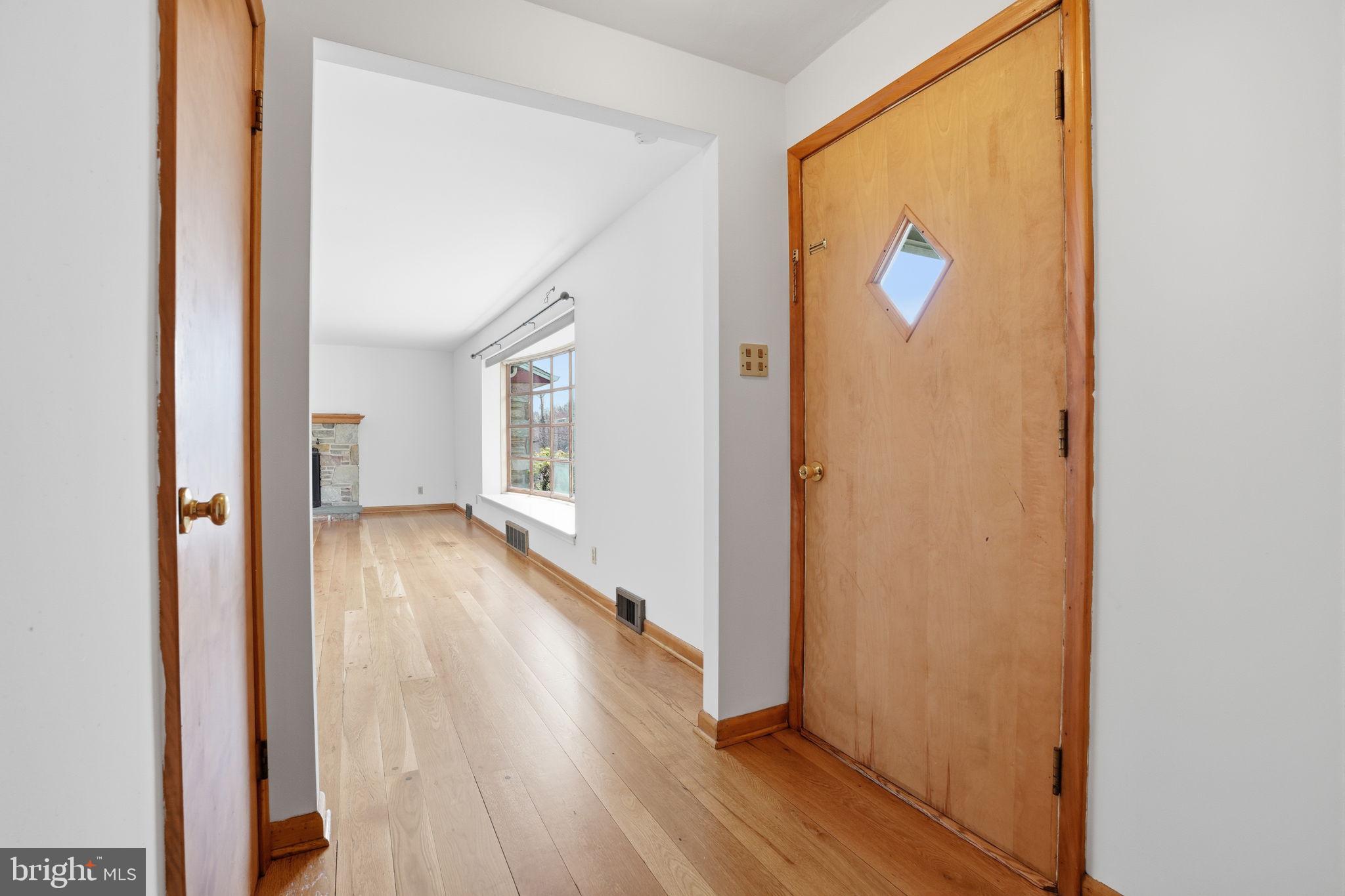 10 Home Road Hatboro, PA 19040 - Photo 6 of 42 a view of a hallway with wooden floor