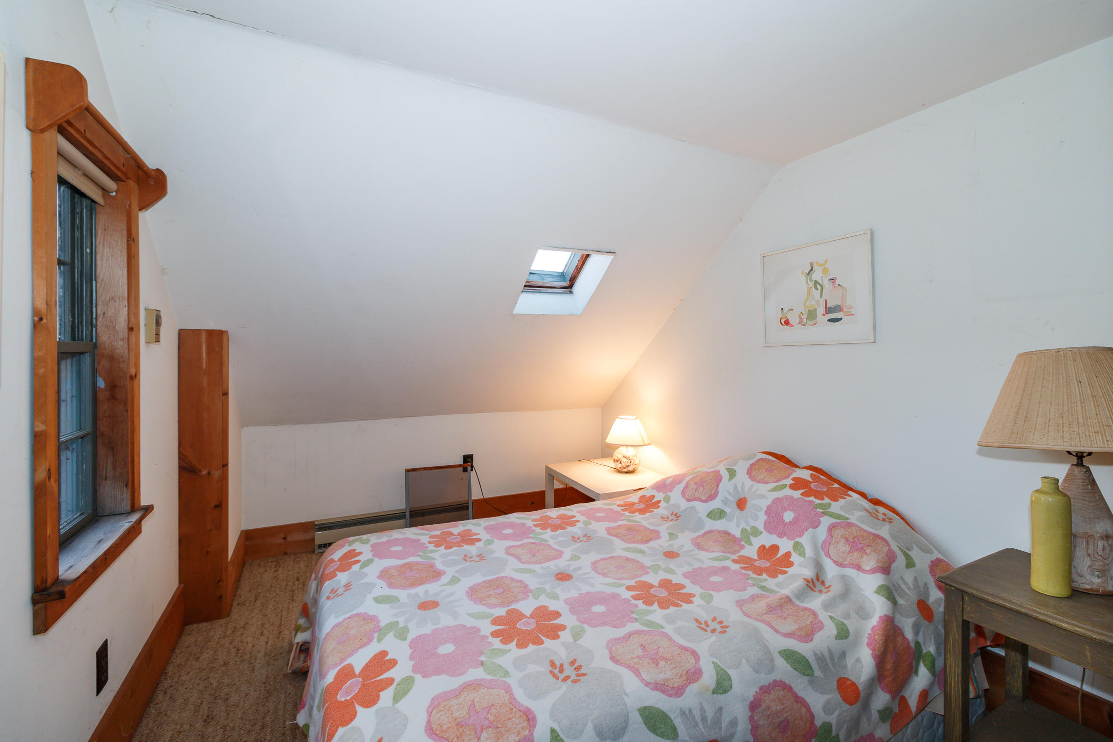 80 Old Dam Road Bourne, MA 02532 - Photo 15 of 31 a bedroom with a bed and a lamp on table