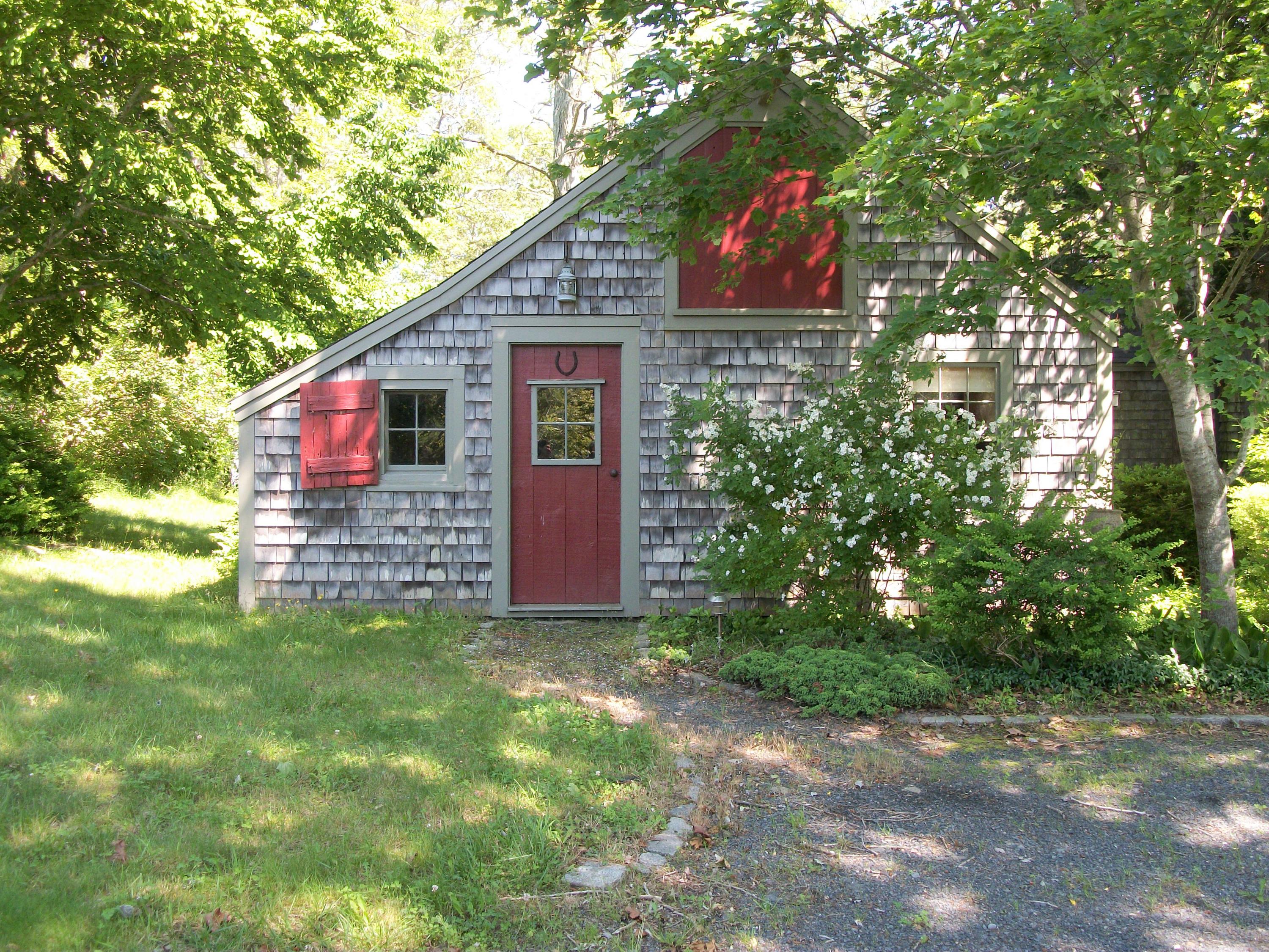 80 Old Dam Road Bourne, MA 02532 - Photo 18 of 31 a backyard of a house with lots of green space