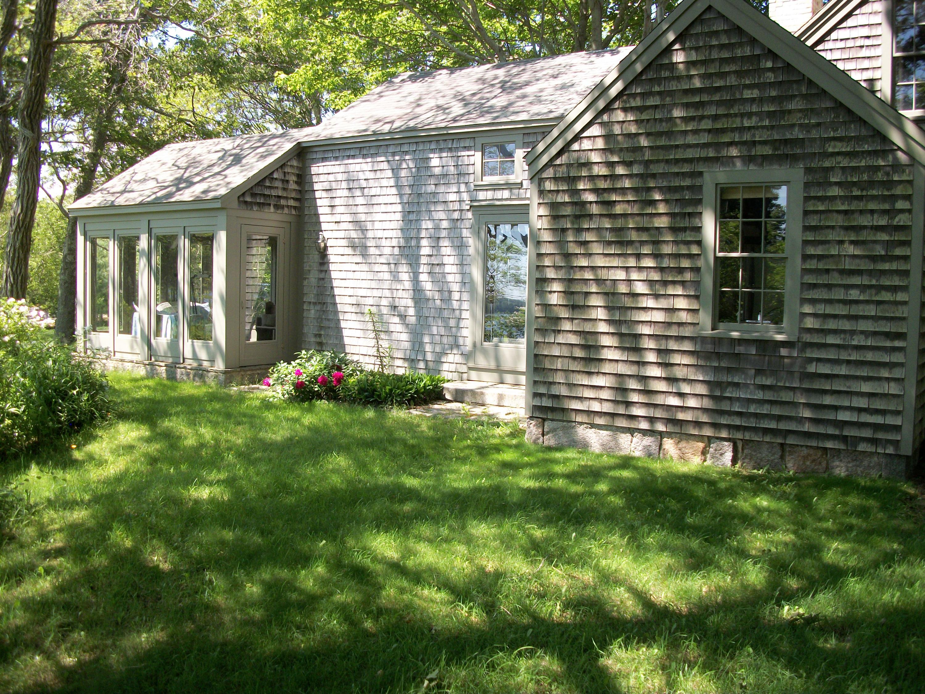 80 Old Dam Road Bourne, MA 02532 - Photo 29 of 31 a front view of a house with a yard