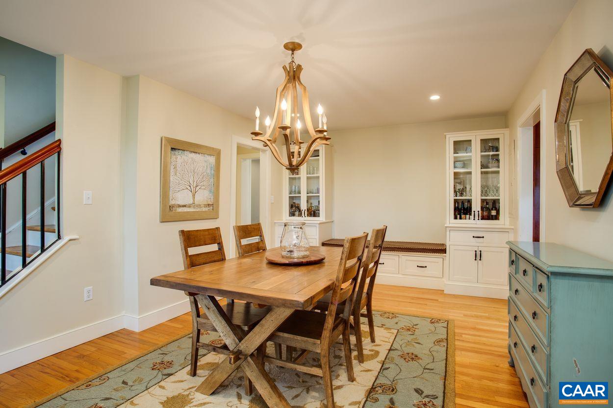 3923 Free Union Road Charlottesville, VA 22901 - Photo 12 of 52 a view of a dining room with furniture and wooden floor