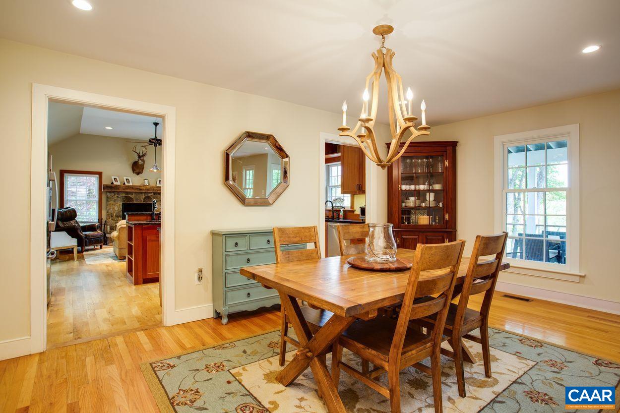 3923 Free Union Road Charlottesville, VA 22901 - Photo 15 of 52 a view of a dining room with furniture and wooden floor