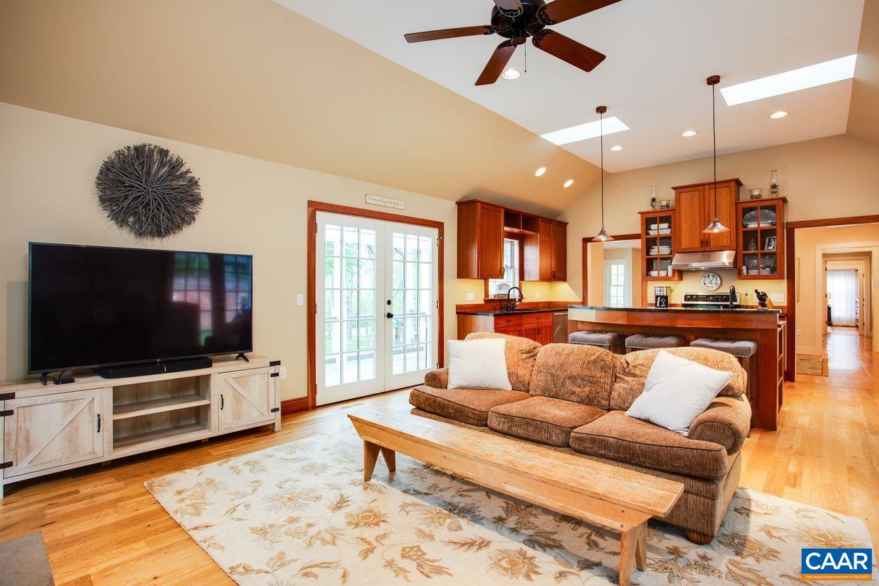 3923 Free Union Road Charlottesville, VA 22901 - Photo 17 of 52 a living room with furniture and a flat screen tv