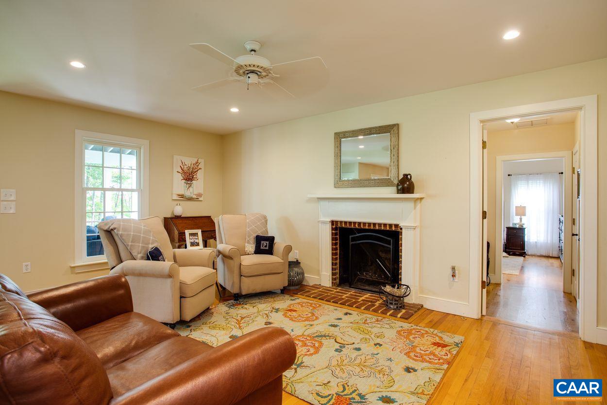 3923 Free Union Road Charlottesville, VA 22901 - Photo 23 of 52 a living room with furniture and a fireplace