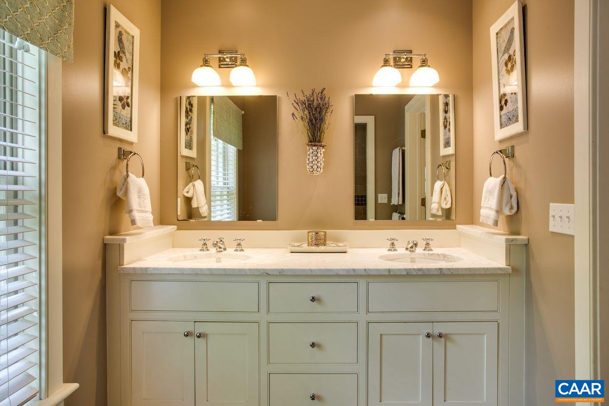 3923 Free Union Road Charlottesville, VA 22901 - Photo 29 of 52 a bathroom with a double vanity sink and a mirror