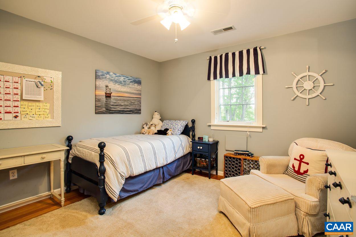 3923 Free Union Road Charlottesville, VA 22901 - Photo 30 of 52 a bedroom with a bed and a window