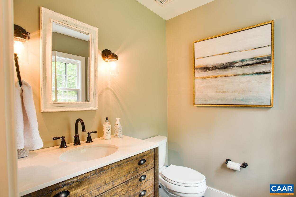 3923 Free Union Road Charlottesville, VA 22901 - Photo 35 of 52 a bathroom with a granite countertop sink mirror vanity and toilet