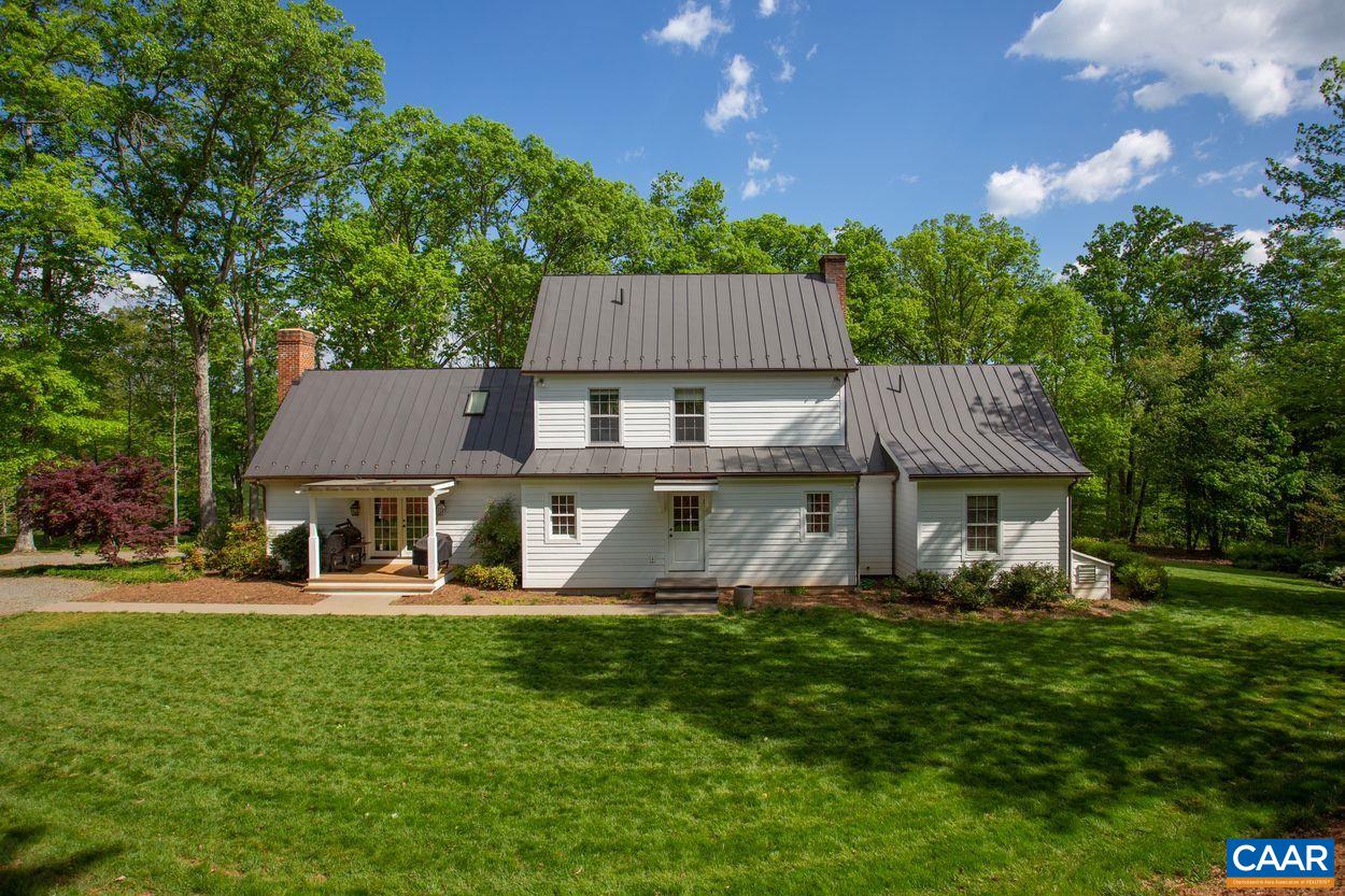 3923 Free Union Road Charlottesville, VA 22901 - Photo 6 of 52 a front view of a house with a garden and trees