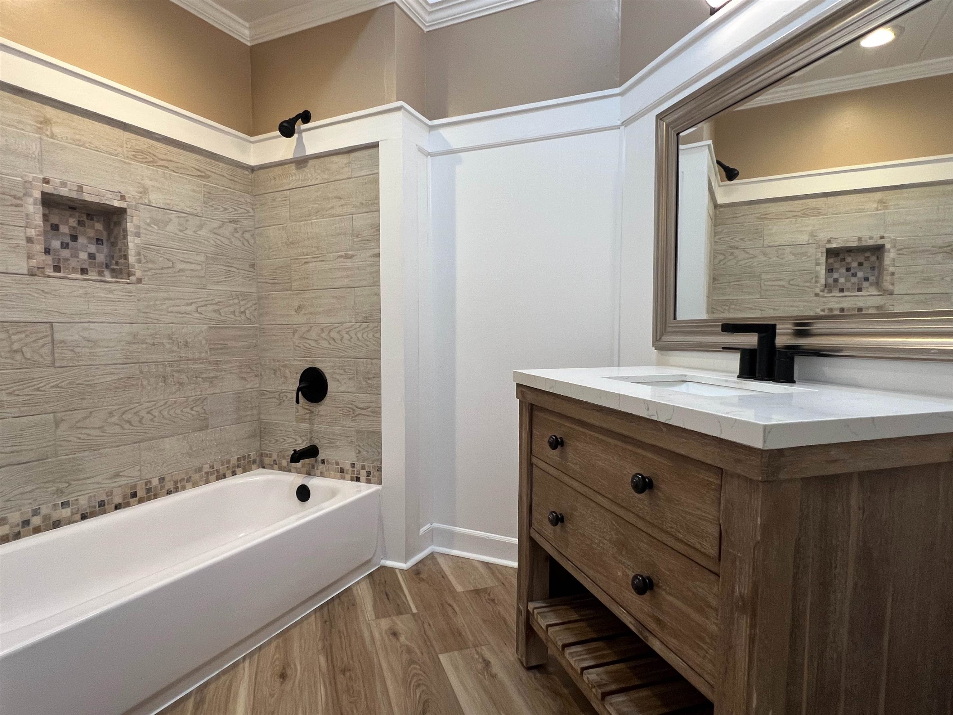 9490 Highway 196 Collierville, TN 38017 - Photo 32 of 40 Full bath featuring ornamental molding, vanity, light wood-style flooring, and washtub / shower combination