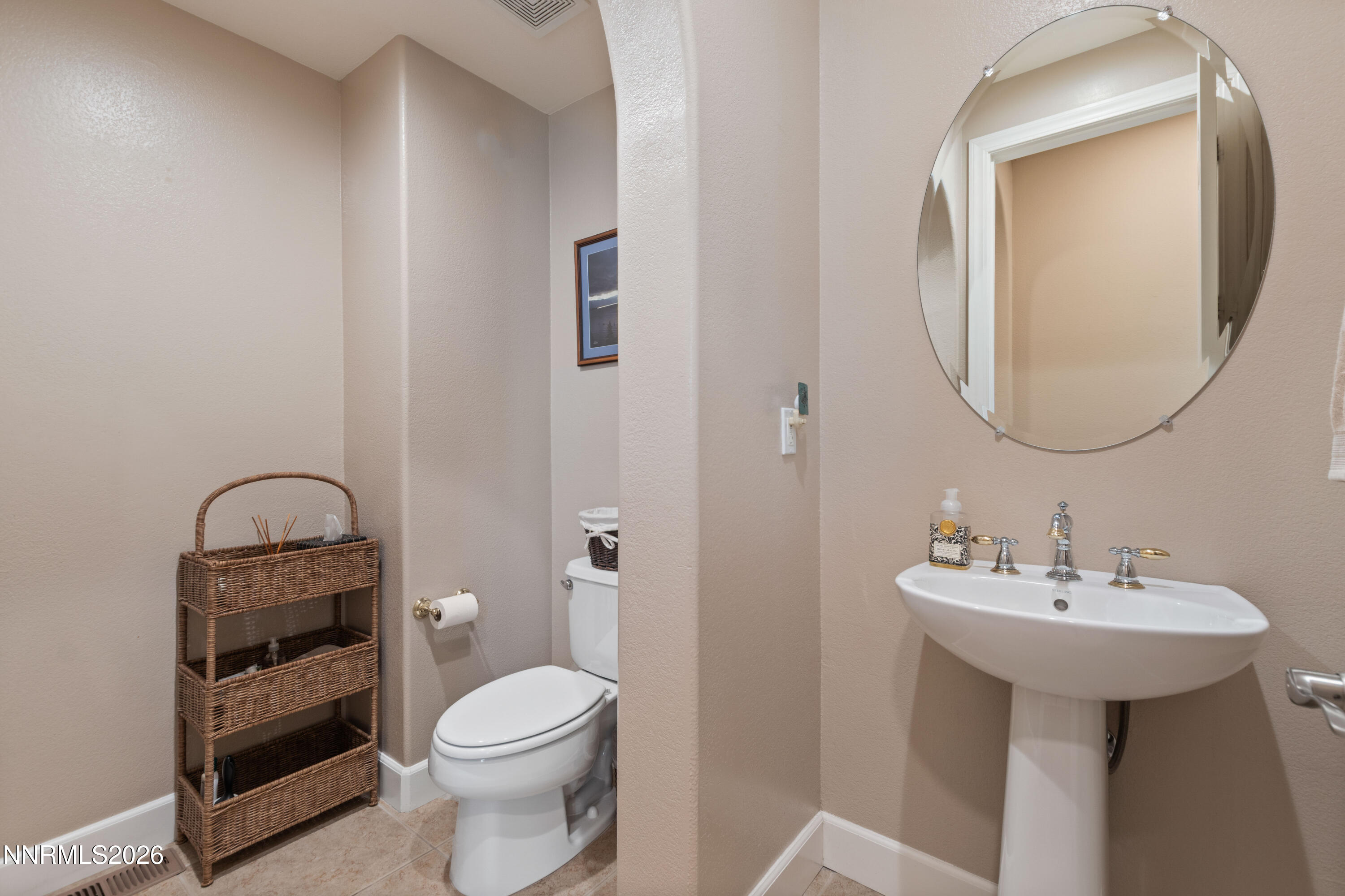 2395 Ridge Field Trail Reno, NV 89523 - Photo 17 of 44 a bathroom with a sink toilet and a mirror