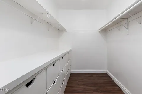 a view of hallway with wooden floor