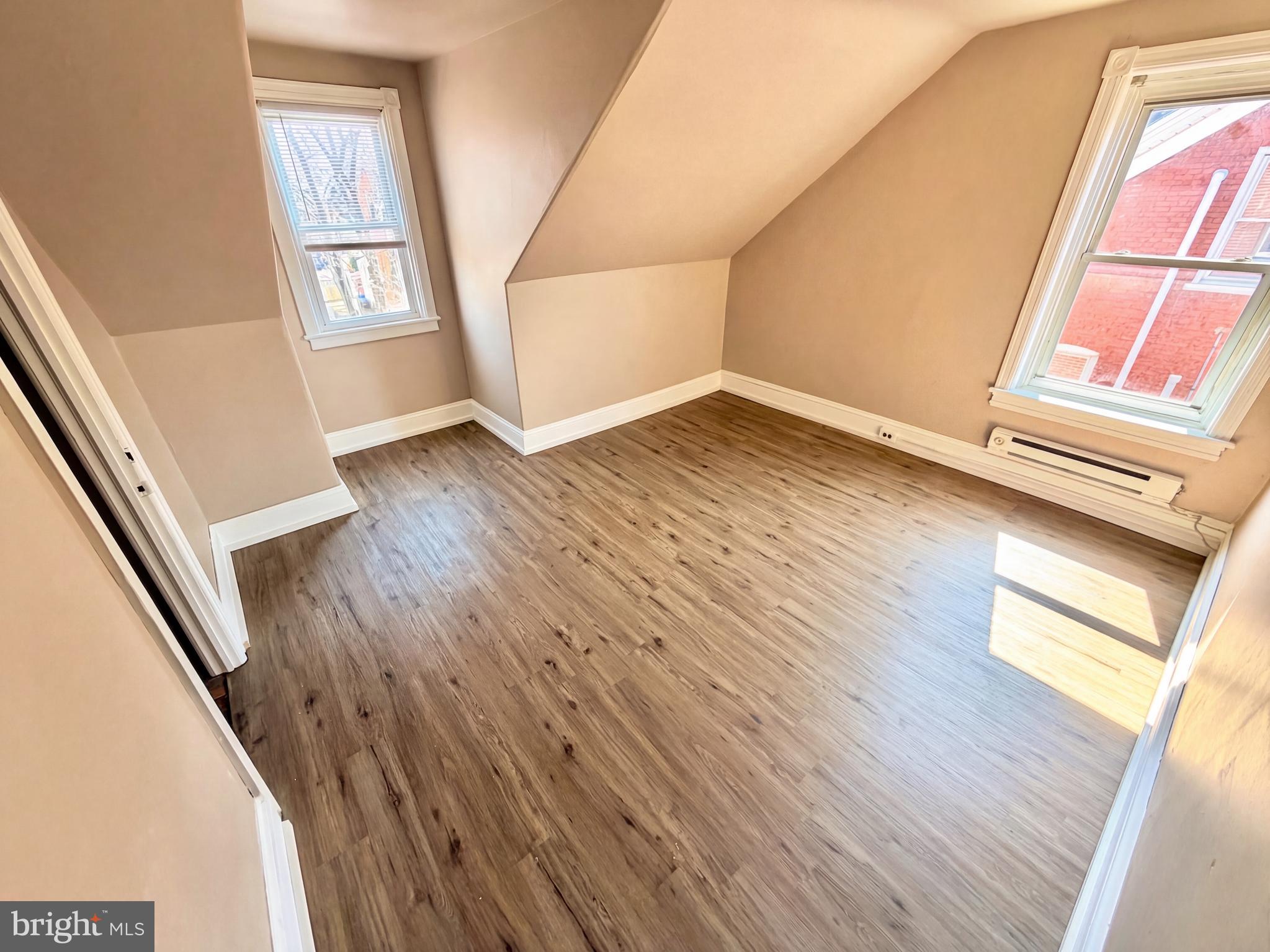 19 4th Avenue Roebling, NJ 08554 - Photo 14 of 20 an empty room with wooden floor and windows