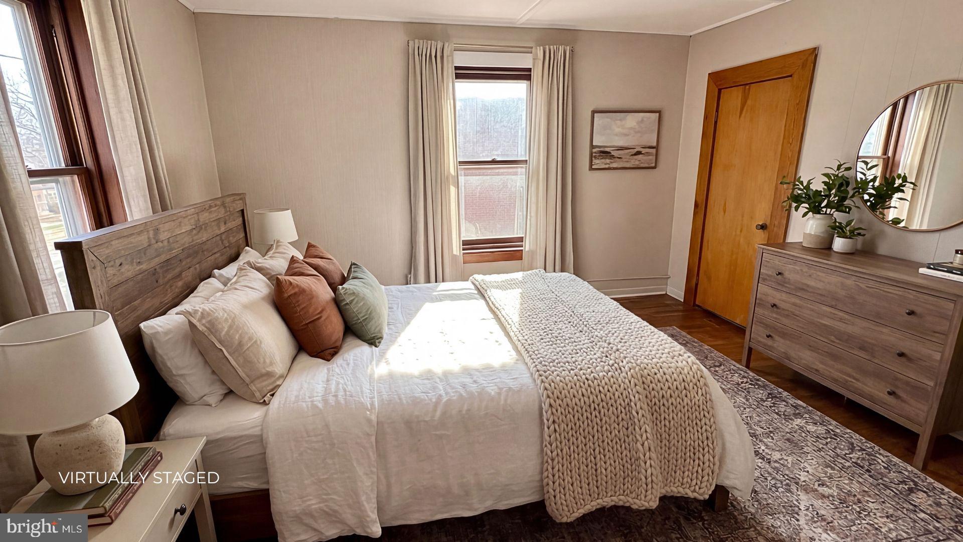 19 4th Avenue Roebling, NJ 08554 - Photo 16 of 20 a bedroom with a bed and dresser with mirror