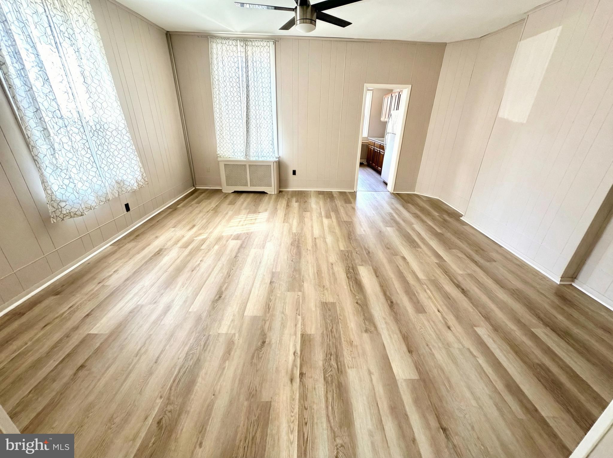 19 4th Avenue Roebling, NJ 08554 - Photo 6 of 20 an empty room with wooden floor and windows