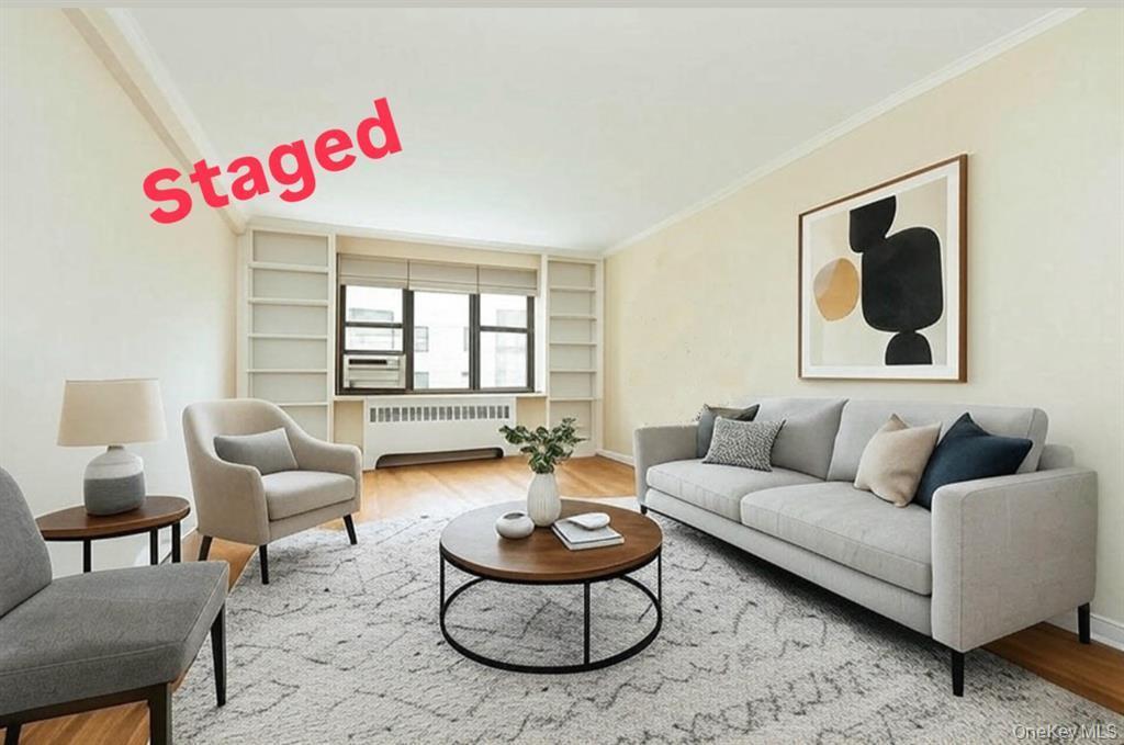 2 Town House Place, Unit 3N Great Neck, NY 11021 - Photo 11 of 26 a living room with furniture and a large window